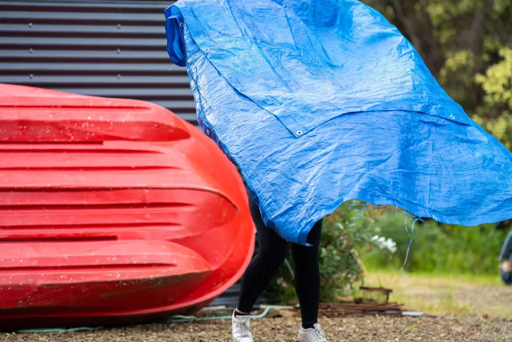 Debris tarp catching roofing waste